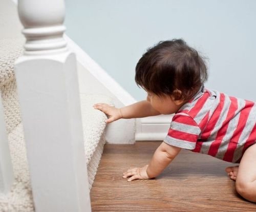 Baby trying to climb the stairs