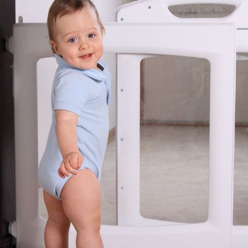 toddler with baby safety gate